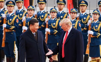 Chinese President Xi Jinping and US President Donald Trump shake hands last November during Trump’s visit to Beijing. Photo: TNS