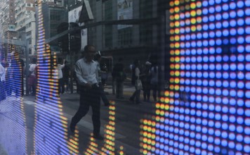 Hong Kong’s benchmark Hang Seng Index closed on Friday at a fresh 18-month low 24,717.63. Photo: Sam Tsang