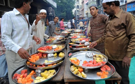 Muslim volunteers in Ahmedabad prepare food for a fast-breaking Iftar party during Ramadan. Photos: AFP