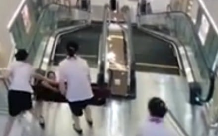 Chinese woman has narrow escape as mall escalator floor collapses just ...