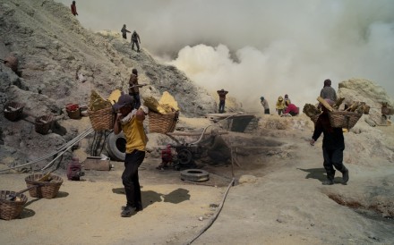 Porters carrying sulphur down the mountain in 2009. Their plight spurred Swiss trekker Heinz von Holzen to help them. Photo: Heinz von Holzen. Porters carrying sulphur down the mountain in 2009. Their plight spurred Swiss trekker Heinz von Holzen to help them. Photo: Heinz von Holzen.