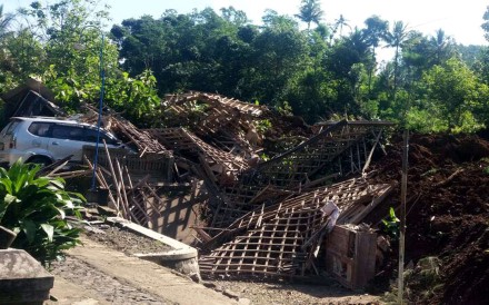 A car damaged after a landslide hit the village of Banaran, Ponorogo region in East Java, Indonesia. Photo: EPA A car damaged after a landslide hit the village of Banaran, Ponorogo region in East Java, Indonesia. Photo: EPA