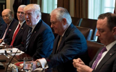 US President Trump (C) speaks surrounded by White House Chie for Staff Reince Priebus (R), US Secretary of State Rex Tillerson (2nd R), Vice President Mike Pence (2nd L) and Commerce Secretary Wilbur Ross (L) during a lunch meeting with Argentinian President Mauricio Macri at the White House in Washington, DC, April 27, 2017. / AFP PHOTO / JIM WATSON