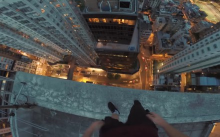 A screengrab of rooftopper James Kingston performing stunts in Hong Kong, captured from a YouTube video. Photo: Handout