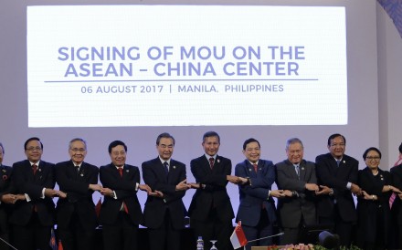 China’s Wang Yi (fifth from left) links arms with the other Asean foreign ministers in Manila on August 6. Photo: EPA China’s Wang Yi (fifth from left) links arms with the other Asean foreign ministers in Manila on August 6. Photo: EPA