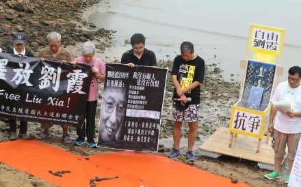 Members of the Hong Kong Alliance in Support of Patriotic Democratic Movements of China hold a memorial service by the sea in Sai Kung to commemorate Noble Laureate Liu Xiaobo. Photo: David Wong