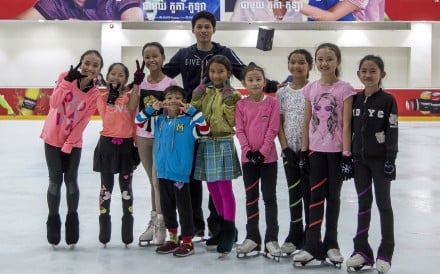 Sen Bunthoeurn, who competed at the Southeast Asian Games, with some of the young skaters he coaches in Phnom Penh.