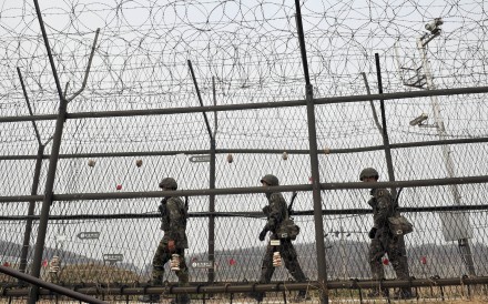 South Korean soldiers patrol along a military fence near the demilitarised zone dividing the two Koreas in the border city of Paju. Photo: AFP