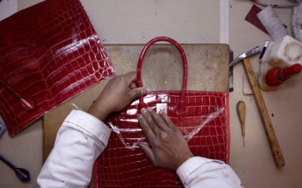 An artisan working at Hermès leather atelier