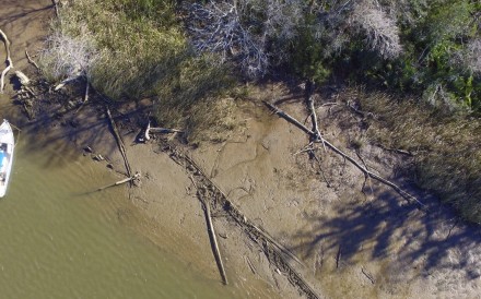 This aerial photo taken on January 2, 2018, in Mobile County, Alabama, shows the remains of a ship that could be the Clotilda, the last slave ship documented to have delivered captive Africans to the United States. The Clotilda was burned after docking in Mobile, Alabama, in 1860, long after the importation of humans was banned, and experts say the remains found by a reporter from Al.com could be what is left of the long-lost wreck. Photo: Al.com via AP