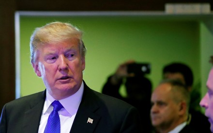 US President Donald Trump walks in a corridor after a meeting during the World Economic Forum (WEF) annual meeting in Davos, Switzerland on Thursday. Trump has suggested that he would rejoin the Trans-Pacific Partnership. Photo: Reuters