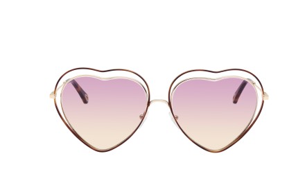 Chloé. Featuring a heart-shaped frame, the ’70s-inspired Poppy sunglasses in rose honey are matched with floating gradient pink to yellow lenses, HK$3,500