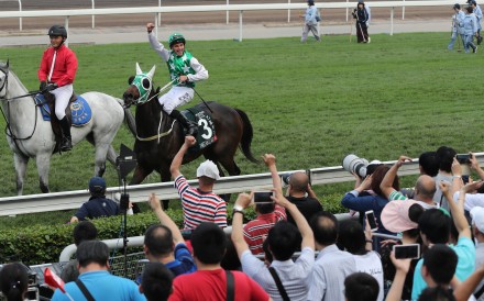 William Buick celebrates Pakistan Star’s QE II Cup win with the fans. Photos: Kenneth Chan