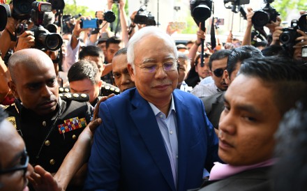 Najib Razak arrives at the Malaysian Anti-Corruption Commission for questioning last month. So far, there have been no public images of his arrest. Photo: AFP
