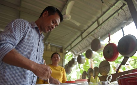A Cambodian refugee who was deported from the US prepares dough as he makes pizza for a group of other deportees in Battambang, Cambodia. Photo: AFP