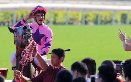Sam Clipperton returns to scale after winning aboard Hot King Prawn. Photos: Kenneth Chan