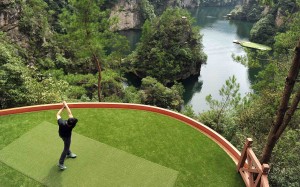 Novelty golf promotions in China, like this shoot-out into a lake in Hangjiajie, Hunan province, are unlikely to be seen again after President Xi Jinping's crackdown. Photo: Reuters