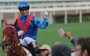 Joao Moreira celebrates with the crowd after making it a treble on Rapper Dragon. Photo: Kenneth Chan