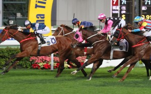 Jockey Zac Purton (pink sleeves) and Beauty Generation flash home for second behind My Darling on December 27 at Sha Tin over 1,400m. A step up to 1,600m on Sunday should benefit the John Moore-trained four-year-old. Photos: Kenneth Chan