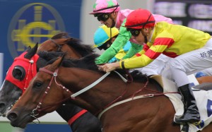 Sam Clipperton urges Booming Delight to hold off his rivals. Photos: Kenneth Chan