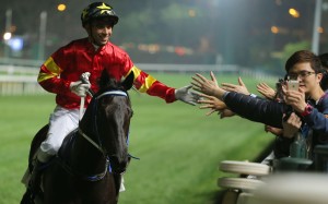 Joao Moreira poses for a selfie with a fan after winning aboard Marvel Hero at Happy Valley on Wednesday night. Photos: Kenneth Chan