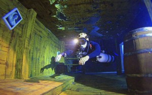 A participant diving in the pool at the Divecube Hotel.