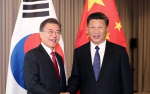 South Korean President Moon Jae-in (left) meets Chinese President Xi Jinping for talks in Berlin in July. The leaders exchanged messages on Thursday to mark 25 years of diplomatic ties. Photo: EPA