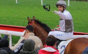 Joao Moreira throws his goggles to a fan after winning aboard Ivictory on Sunday. Photos: Kenneth Chan