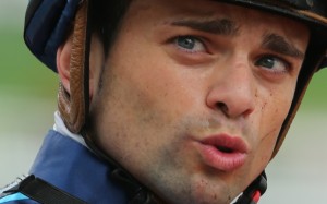 Jockey Umberto Rispoli flailed his whip at Mister Monte to stop the horse trying to bite him on Wednesday night. Photo: Kenneth Chan