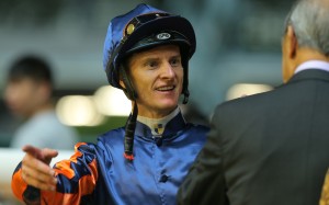 Jockey Zac Purton talks to former Jockey Club chairman Ronald Arculli after winning aboard Red Warrior at Happy Valley. Photo: Kenneth Chan