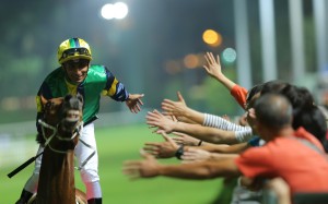 Karis Teetan high fives fans after a win at Happy Valley on Wednesday night. Photos: Kenneth Chan