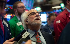 Traders work on the floor of the New York Stock Exchange on December 6. A miscommunication from the Fed can have amplified market effects, even if the statements contain a degree of truth. Photo: AFP
