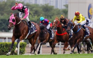 Zac Purton gives Beauty Generation a pat as he careers away with the Hong Kong Mile. Photos: Kenneth Chan