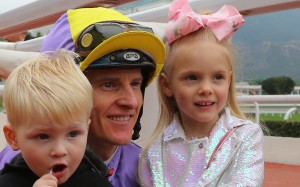 Jockey Zac Purton smiles for the cameras with his two children Cash (left) and Roxy (right) after winning on Time To Celebrate at Sha Tin on Sunday. Photos: Kenneth Chan