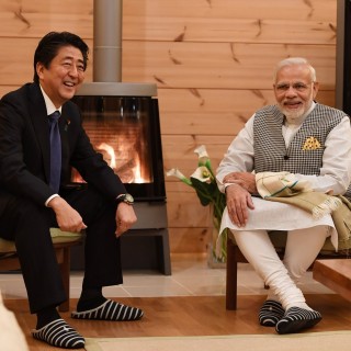Japanese leader Shinzo Abe and his Indian counterpart Narendra Modi sit by the fire at Abe's holiday home. The fact that the two leaders met at Abe's residence has been highlighted as symbolic of their close relationship. Photo: Twitter