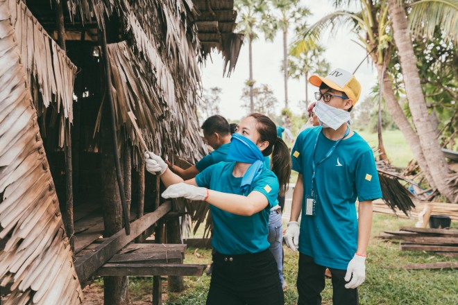 During the “World As One” journey to Cambodia, participants help impoverished households demolish their old dwellings and build new ones.