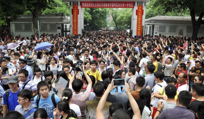 Students walk out of a school after taking the first section of the national college entrance exam in Changsha, Hunan province in 2014.