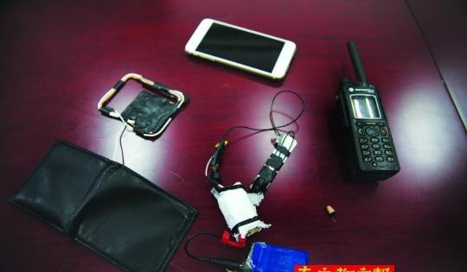 A transmitter setup hidden in a wallet.