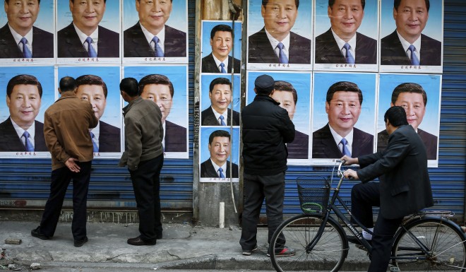 Posters of Xi Jinping, who is now able to rule China indefinitely.