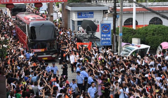 Students traveling to take their annual exams are seen off by crowds outside Maotanchang Middle School in Anhui province, central China.