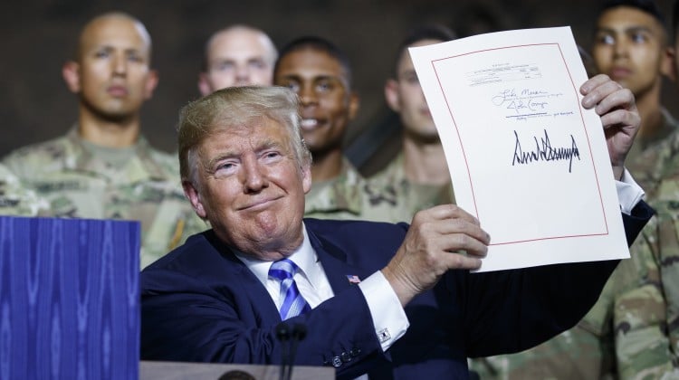 US President Donald Trump after a signing ceremony in August for a defence bill that included an expansion of CFIUS's national security review role. Photo: AP