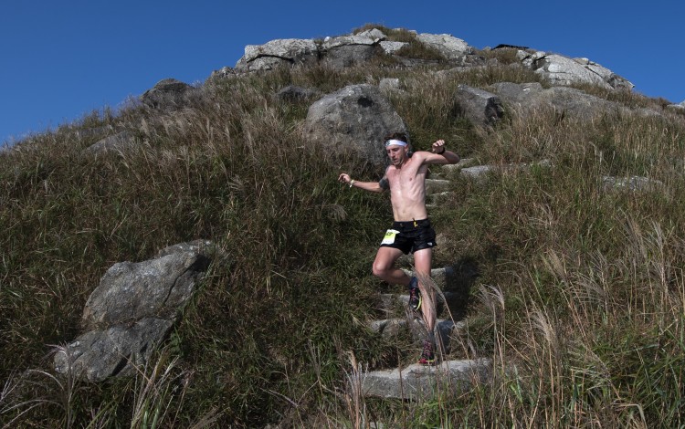 Vlad Ixel comes off Lantau Peak at the front of the pack. Photos: Action Asia