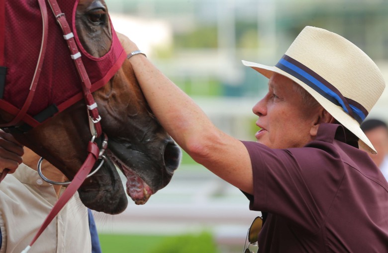 John Moore gives Rapper Dragon a pat after his win in the Lion Rock Trophy on Sunday. Rapper Dragon will spearhead Moore’s Derby team next season. Photo: Kenneth Chan