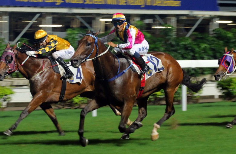 Karis Teetan gets Blocker Dee (outside) over the line to win the last and bring up a treble for trainer Caspar Fownes. Photos: Kenneth Chan