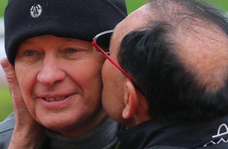 Gary Moore plants a kiss on his brother John’s cheek. Photos: Kenneth Chan