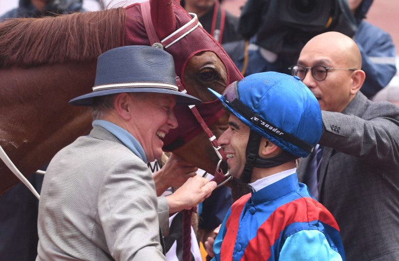 John Moore and Joao Moreira hug after winning the Hong Kong Derby with Rapper Dragon. Photos: Kenneth Chan