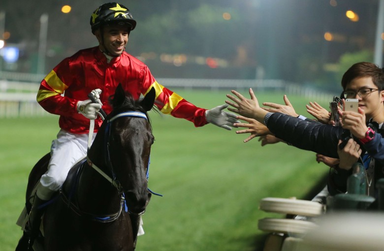 Joao Moreira poses for a selfie with a fan after winning aboard Marvel Hero at Happy Valley on Wednesday night. Photos: Kenneth Chan