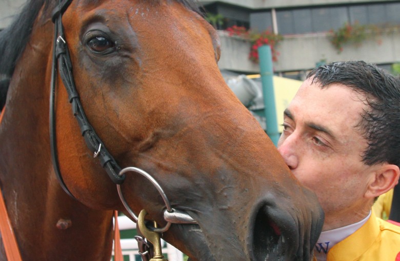 Douglas Whyte gives Akeed Mofeed a kiss after they combined to win the 2013 BMW Hong Kong Derby at Sha Tin. Photos: Kenneth Chan