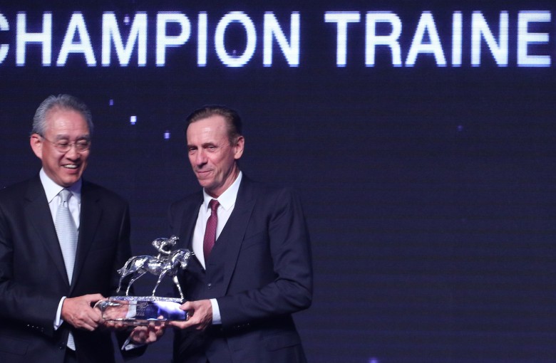 John Size collects his champion trainer trophy in July. Photos: Kenneth Chan