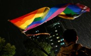 A supporter waves a rainbow flag during a rally after Taiwan’s constitutional court ruled that same-sex couples have the right to legally marry, the first such ruling in Asia, in Taipei on Wednesday. Photo: Reuters